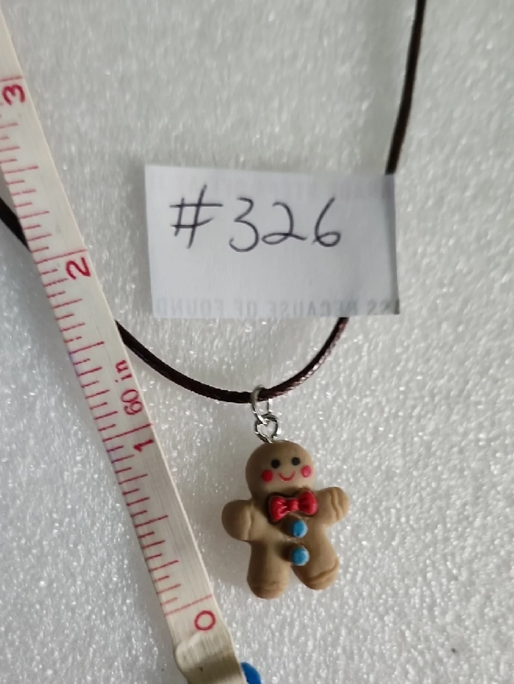 Hand Crafted Brown Gingerbread Man Necklace with Red and Blue Accents